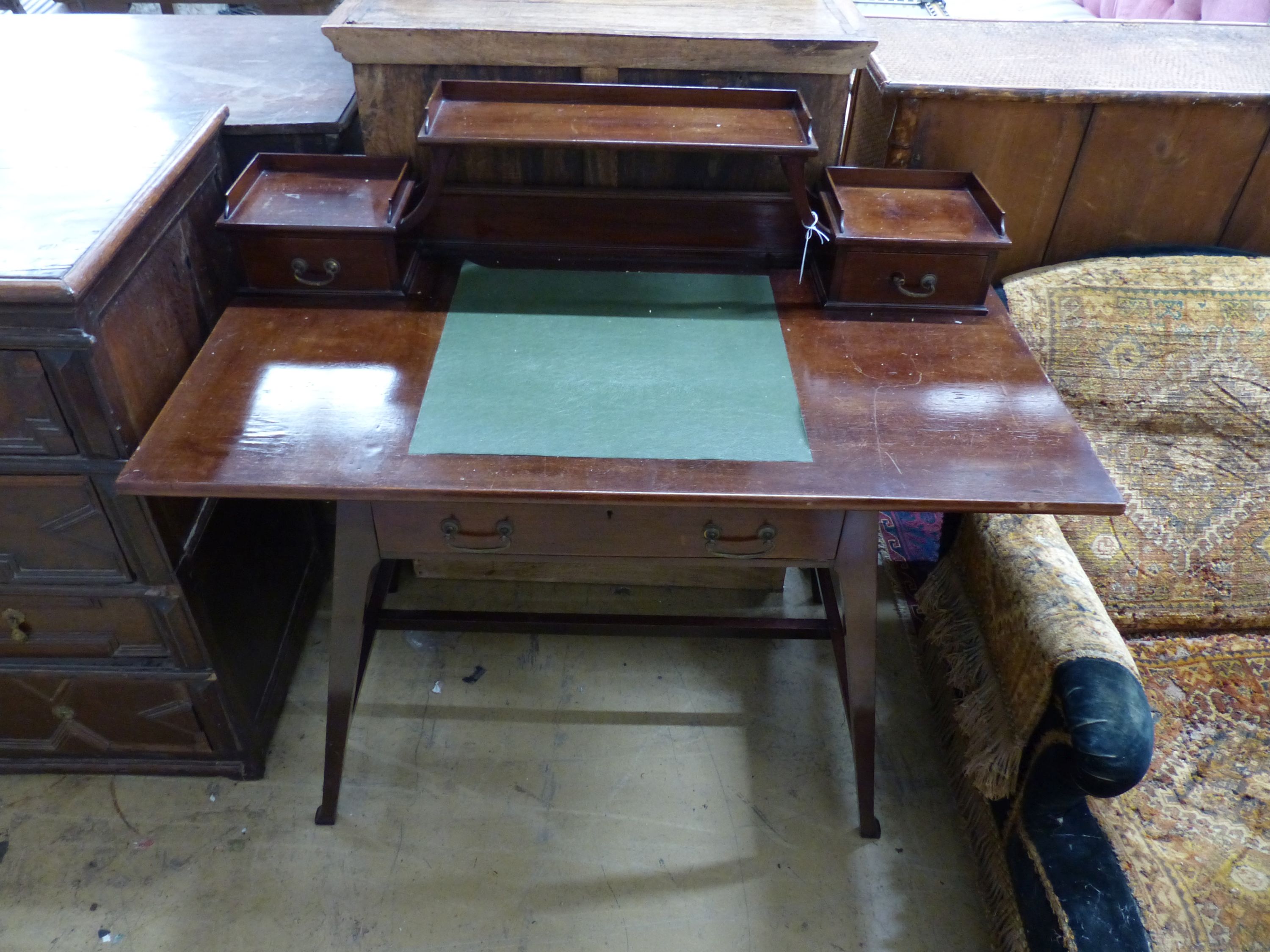 An Edwardian Arts & Crafts mahogany desk, width 111cm